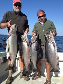 Salmon fishing on the easter basin of lake ontario on a charter boat